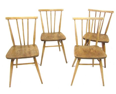 A set of four Ercol beech and elm kitchen chairs. 