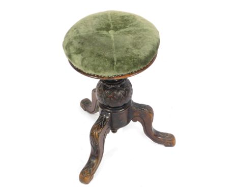 A Victorian swivel piano stool, with green materiel top with central button, on tripod base, 50cm high, 31cm diameter.