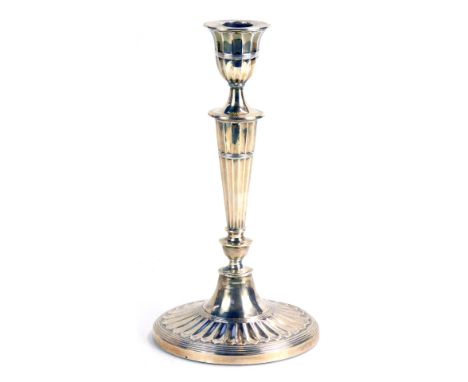 A Victorian silver candlestick, of tapered form on oval weighted base, London 1888, 8cm high, 29oz gross.