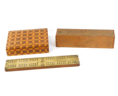 A set of bone and ebony nine button dominoes, boxed, together with a brass topped cribbage board, and a wooden two division c
