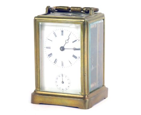 A 20thC brass carriage clock, with white Roman numeric dial and alarm dial, with a movement number 2704, with swing handle, 1