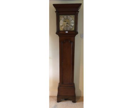 A George III oak longcase clock, with moulded cornice and inset pillared hood, full length moulded arched trunk door, and pla