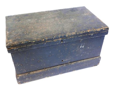 A black stained pine carpenter's tool chest, the hinged lid opening to reveal a fitted interior, containing wheel rights and 
