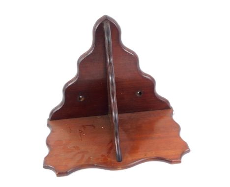 A Victorian mahogany wall bracket, of serpentine form, 37cm high, 44cm wide.