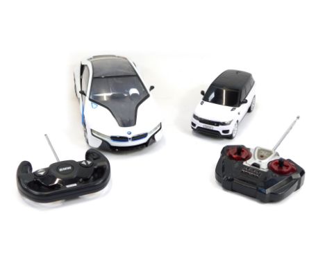 A Rastar remote controlled BMW I8, scale 1:14, together with a Gianfengyuan Toys Company Limited remote control model of a 20