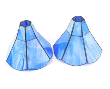 A pair of hexagonal blue marbled glass lamp shades, 17cm high.