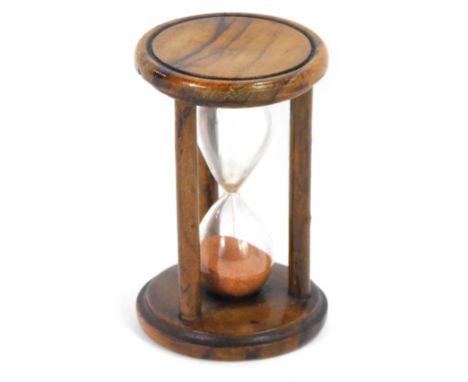 A 19thC treen sand glass egg timer, from Eldridge London, 8cm high. 