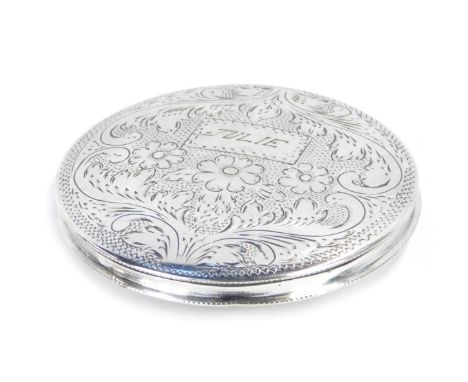 A circular compact, white metal, engraved with flowers and scrolling leaves, rectangular reserve, engraved 'Julie', stamped 8