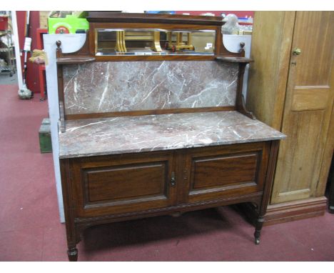 An Early XX Century Mahogany Washstand, with marble top and back, featuring mirror above, on turned legs, 119cm wide.