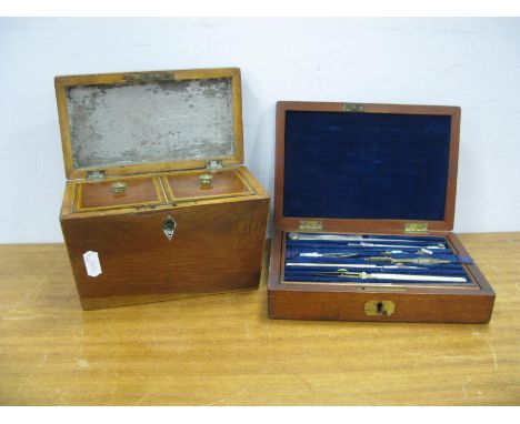 A XIX Century Mahogany Tea Caddy, of sarcophagus form, 18.5cm wide. Geometry set in mahogany case. (2)