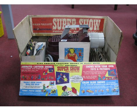 A 1969 Chad Valley 'Supershow' Projector, in original box and with all accessories including Noddy, Popeye etc slides, animat