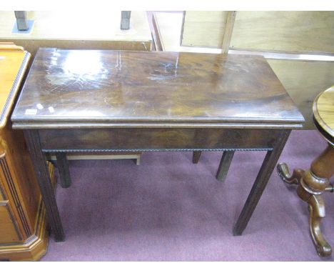 A Late XVIII Mahogany Card Table, with a fold over top, on moulded legs. (damages).