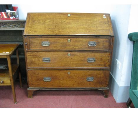 An XVIII Century Mahogany Bureau, with slope front, pigeon hole fitted interior, over three graduated drawers, on bracket fee