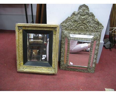 A XVII Century Style Embossed Cushion Brass Mirror, with shell and C scroll decoration, together with a XIX Century gilt mirr