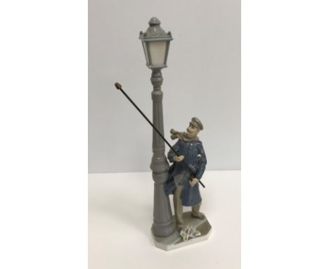 A Lladro figure of The Lamplighter (5205) 47 cm high, another of young girl with doll on a trolley 27.5 cm high, two Lladro f