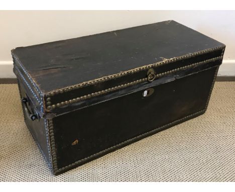 A circa 1800 studded leather trunk of small proportions, the paper-lined interior inscribed "GWW &amp; EW Sept 25 1808", with
