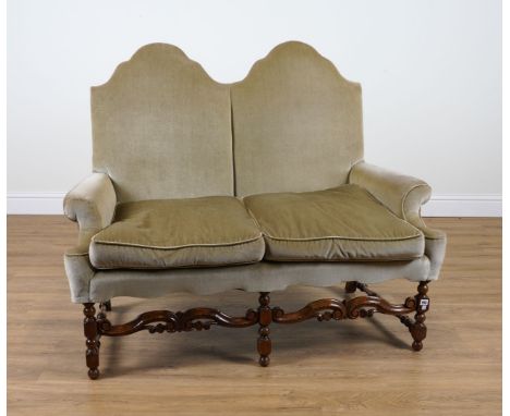 A QUEEN ANNE STYLE DOUBLE HUMPBACK TWO SEATER SOFAWith turned walnut supports, 140cm wide; 114cm highCondition report:&nbsp;I