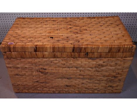 A MODERN RATTAN TRUNK82cm wide; 45cm high