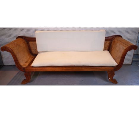 AN EARLY 20TH CENTURY TEAK AND CANEWORK SOFA220cm wide; 81cm high