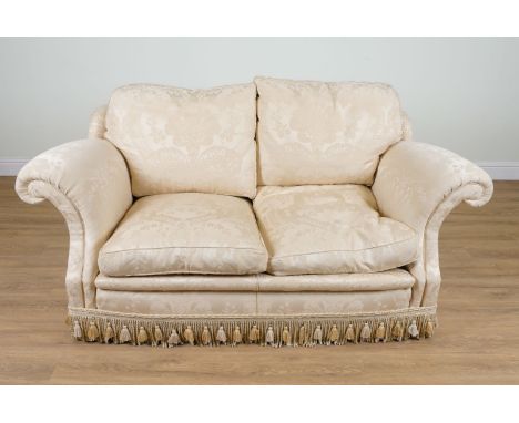 A MODERN TWO SEAT SOFA IN FLORAL GOLD PATTERN UPHOLSTERY196cm wide; 84cm highCondition Report: The cushions are feather fille