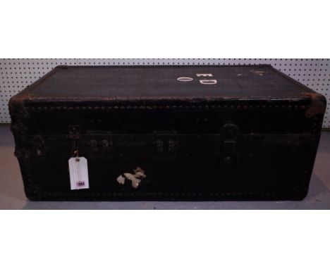 AN EARLY 20TH CENTURY TRAVELLING WARDROBE TRUNK AND TWO SUITCASES55cm wide; 102cm high