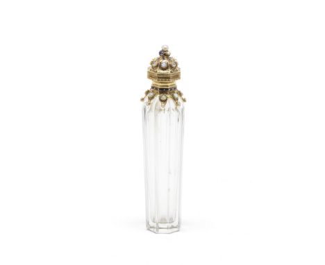 A French gold-mounted scent bottlecirca 1870 Fluted cylindrical body, the gold mount with blue enamel strap-work, opal caboch