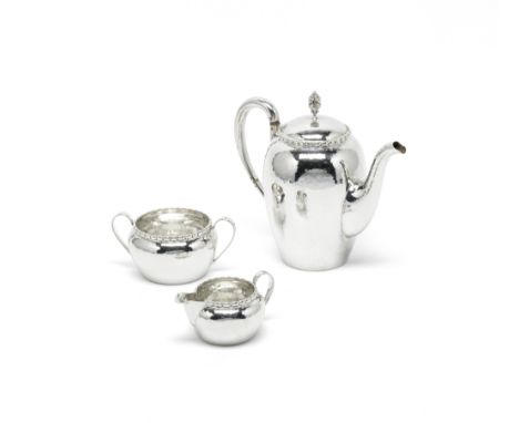 A Swedish three-piece silver coffee serviceK Anderson, Stockholm 1924 Circular, with a hammered finish, the coffee pot with i