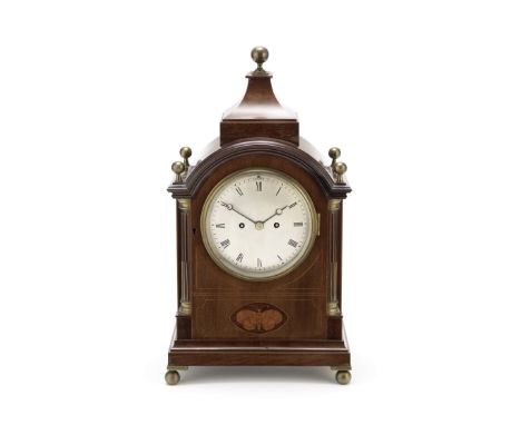 A late 19th century brass mounted mahogany and inlaid mantel timepiecethe arched rectangular case with swept top and ball fin