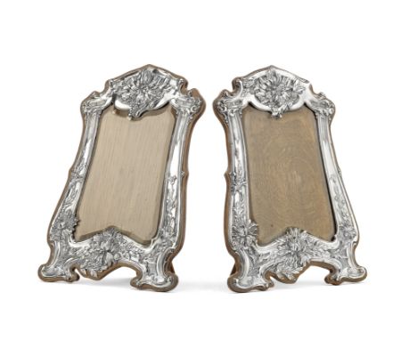 Two matched silver photograph frames,W H Leather, Birmingham 1904 and J &amp; R Griffin, Chester 1906Upright shaped rectangul