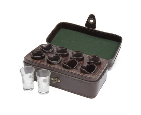 REY PAVON A LEATHER CASED EIGHT SHOT GLASS SET, dark leather case with leather interior.  † Please note this item is subject 