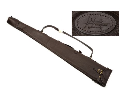 JO YORATH A NEW AND UNUSED LEATHER FLEECE-LINED SINGLE GUNSLIP, with leather shoulder strap and brass fittings.  † Please not