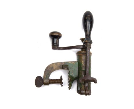 A VINTAGE 4-BORE ROLL-TURN-OVER CARTRIDGE RELOADING TOOL.  