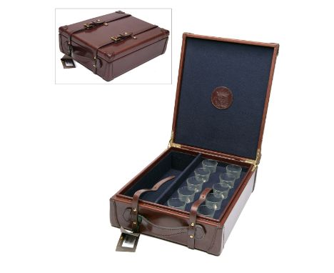 REY PAVON A NEW AND UNUSED LEATHER CASED SET OF TEN SHOT GLASSES, with provision for a bottle of spirits, set in a blue baize