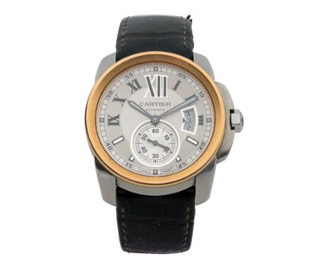 CARTIER, PARIS A BOXED GENTLEMAN'S STEEL AND GOLD CALENDAR AUTOMATIC WRISTWATCH, MODEL 'CALIBRE', serial no. 470387RX, with C