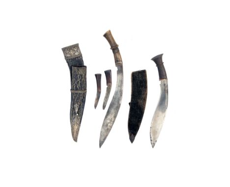 TWO LATE VICTORIAN KUKRI KNIVES, both circa 1890 and Northern Indian or Nepalese, the first with slender curving 14in. blade 