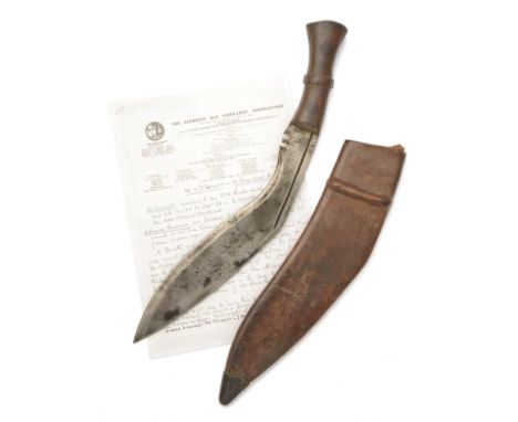 A WORLD WAR TWO KUKRI KNIFE SIGNED 'H.W.', dated for 1945 and made for the Indian Army, with strongly curved 12in. blade mark