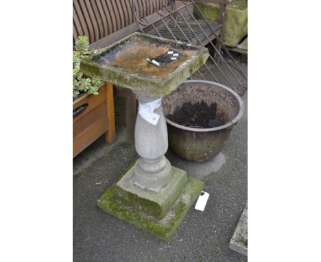 A 20th century stone garden bird bath; a 20th century cast planter