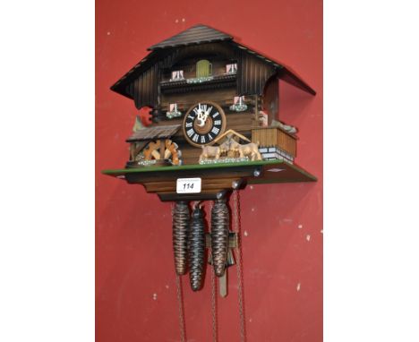 A Swiss cuckoo clock, musical movements, weights and pendulum