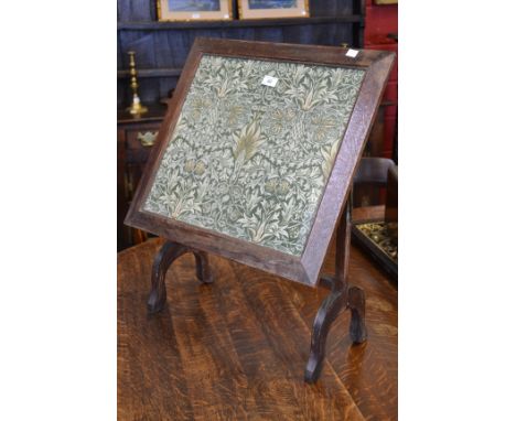 An Arts and Crafts firescreen converting to a table, William Morris fabric