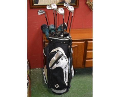 A part set of carbon shaft gold clubs by Howson and Regal, in a Masters golf bag