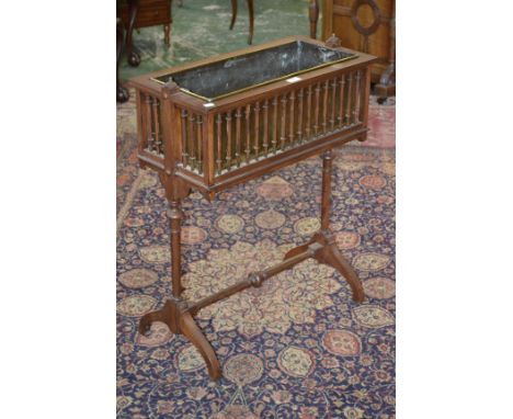 An Arts and Crafts mahogany planter, with brass insert