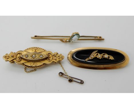 A 15ct gold onyx and pearl set mourning brooch, weight 6.7gms, a 9ct rose cut diamond and pearl brooch and a 9ct gold blue ge