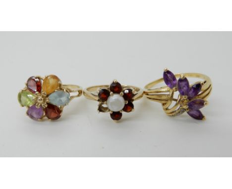 An 18ct gold amethyst and diamond accent ring size T1/2, weight 4.1gms, a 9ct gold multi-colour gem flower cluster ring, size