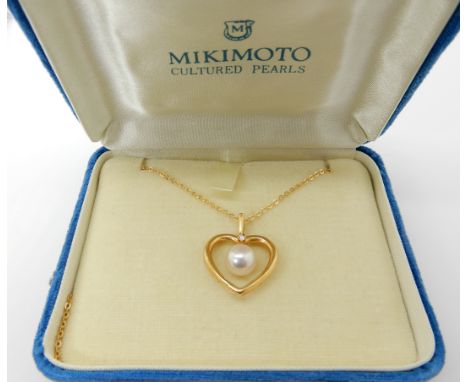 An 18ct gold Mikimoto, diamond and pearl heart shaped pendant, 2.2cm, with an 18ct gold chain length 39cm, weight 4.1gms, the