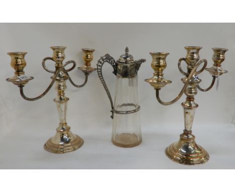 A lot comprising a pair of silver plated three-light candelabra and a silver plate and glass claret jug (3) Condition Report: