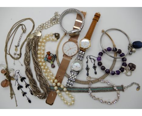 A ladies Gucci watch with a mother of pearl dial and a collection of other watches and costume jewellery Condition Report: No