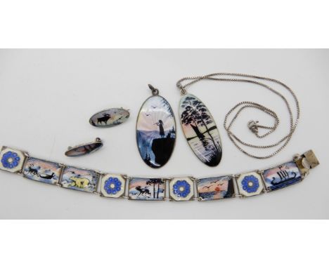 A good collection of Norwegian silver and enamel items to include, a pendant of a girl playing a flute by Aksel Holmsen, a fu