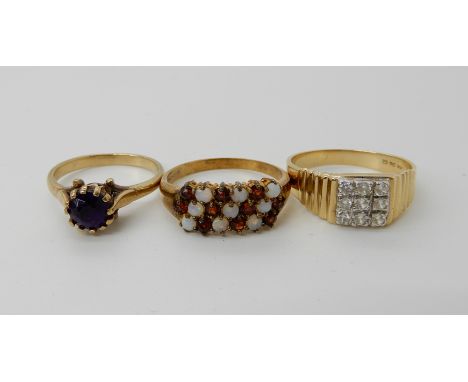 A 9ct gold garnet and opal cluster ring size Q1/2, a 9ct gold amethyst ring size N, weight combined 5.2gms and a 14k gold cle