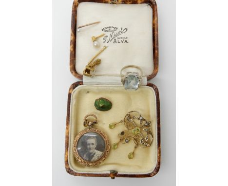 A 9ct pearl and green gem set Edwardian pendant brooch, a 9ct double sided locket, a white metal blue gem set ring, size F1/2