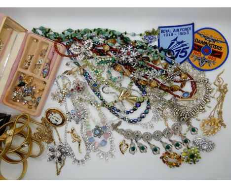 A collection of vintage costume jewellery to include Royal Air Force patch badges, brooches beads etc Condition Report: Not a